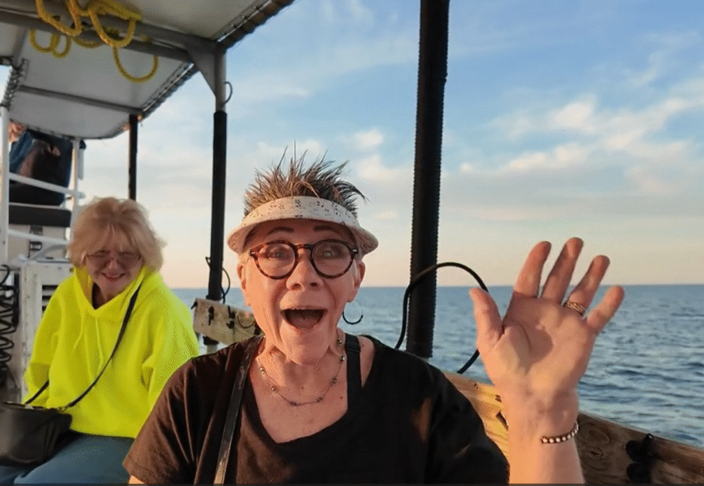 woman waving on the boat